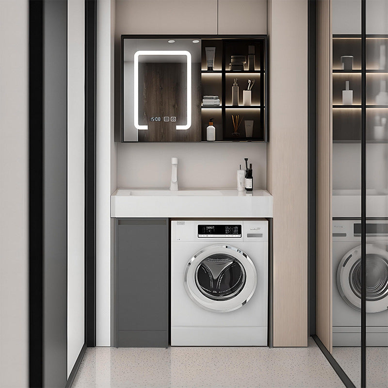 Modern grey laundry vanity with rock slab basin