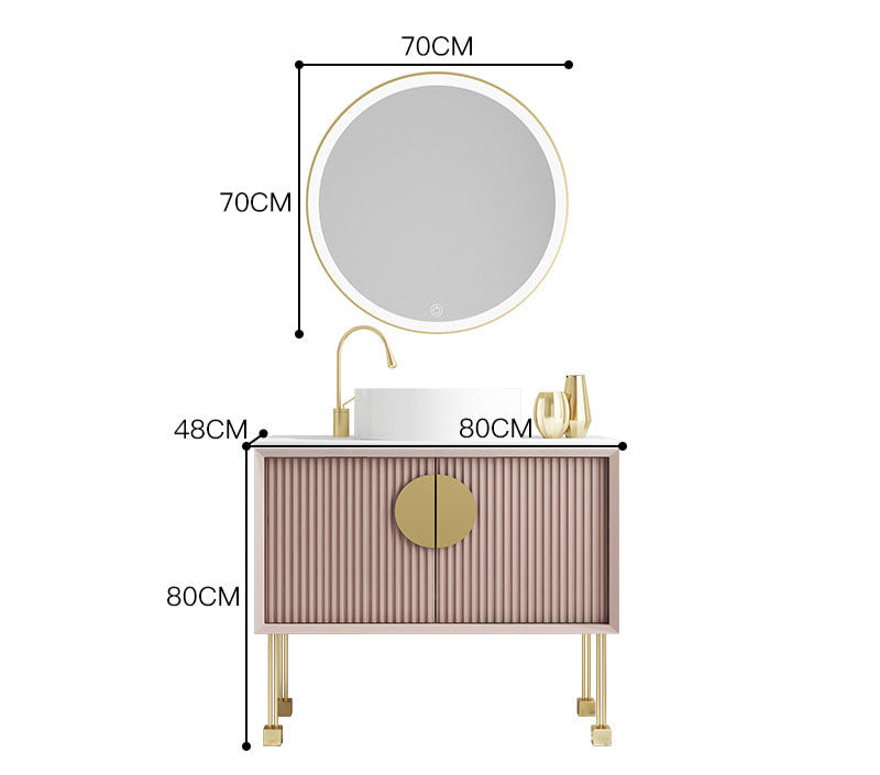 Pink ribbed cabinet with gold hardware bathroom design