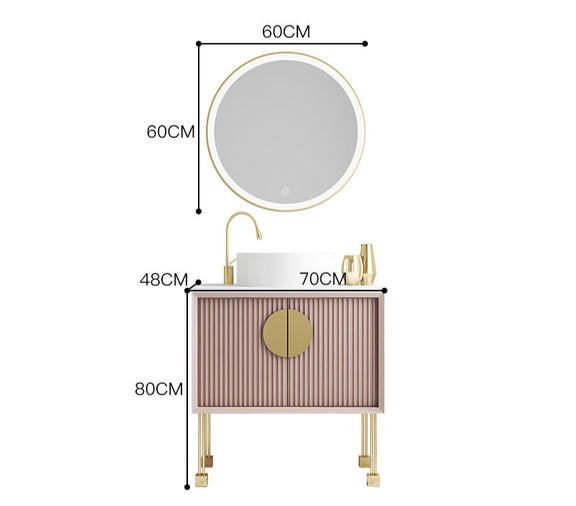Round LED mirror above pink oak vanity set