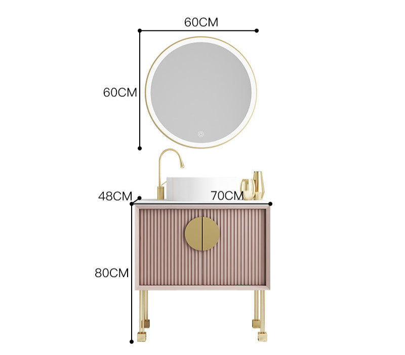 Round LED mirror above pink oak vanity set