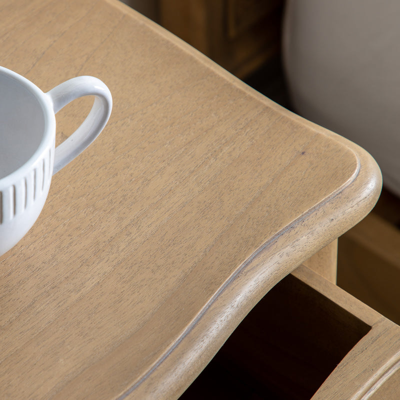 White mug on a wooden surface with a blurred background