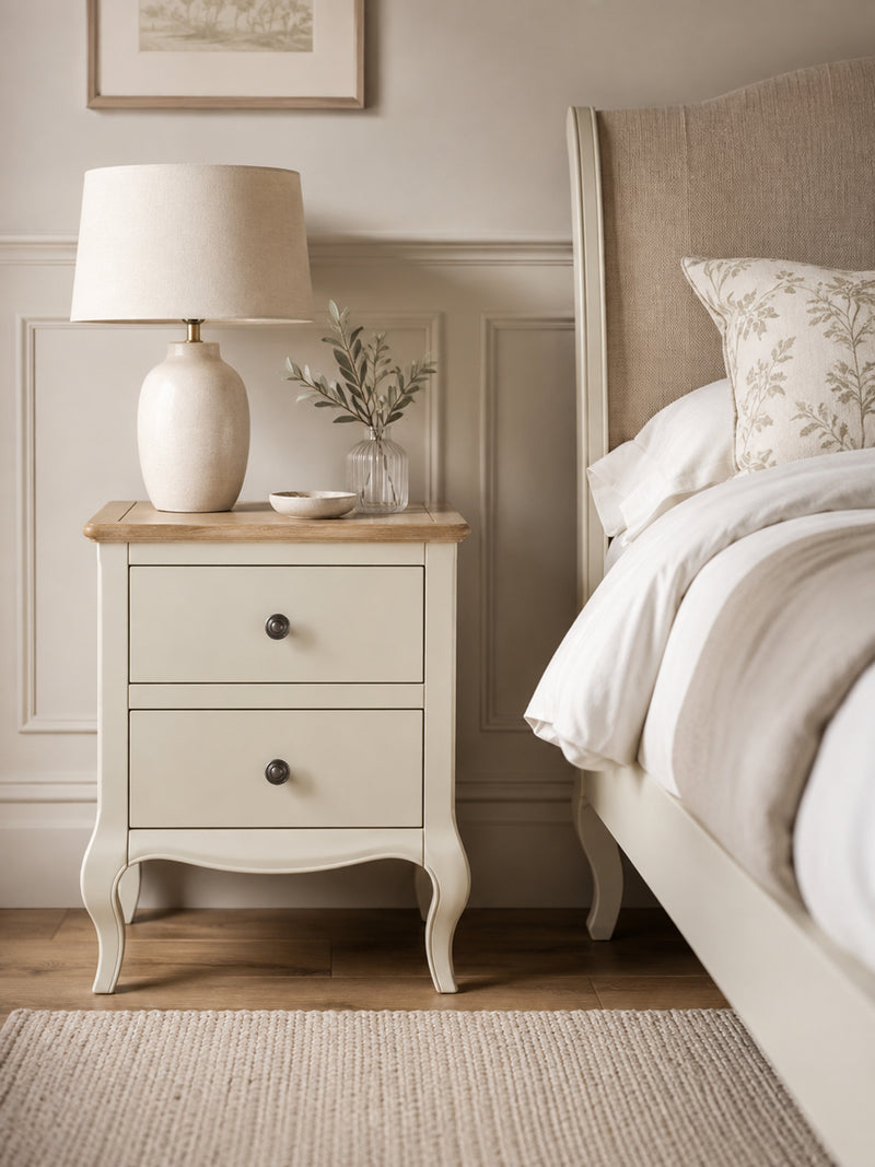 Camille ivory and limed oak 2 drawer bedside table in styled room