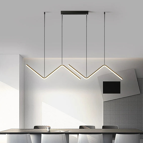 Zig-zag linear LED pendant light in black above dining table