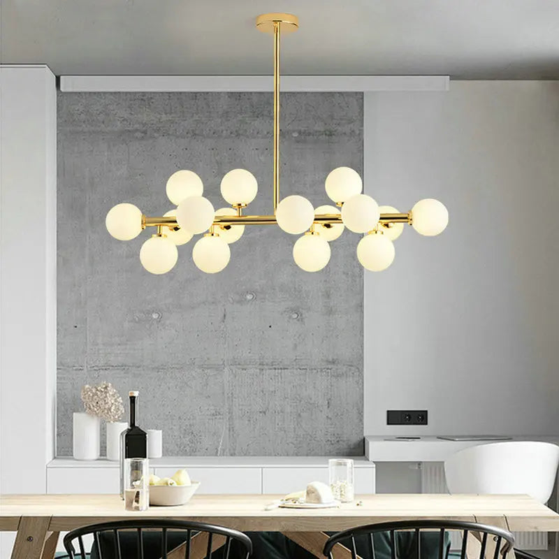 Frosted glass globe lighting ring above kitchen island