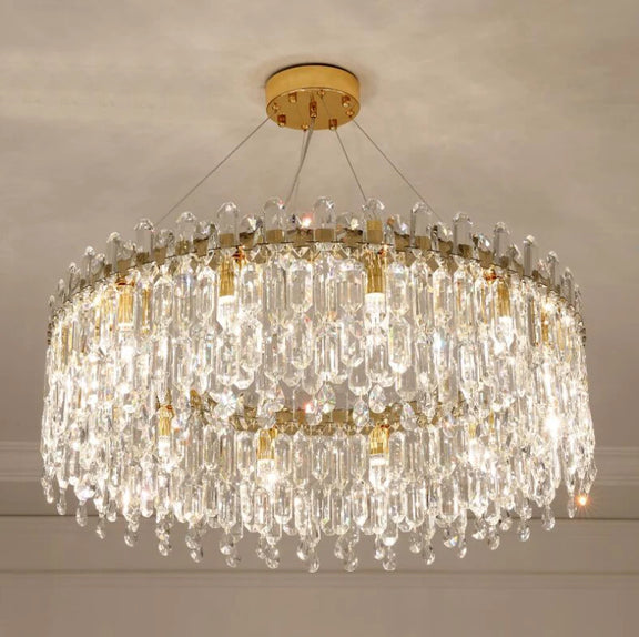 Modern crystal chandelier illuminated in warm LED light