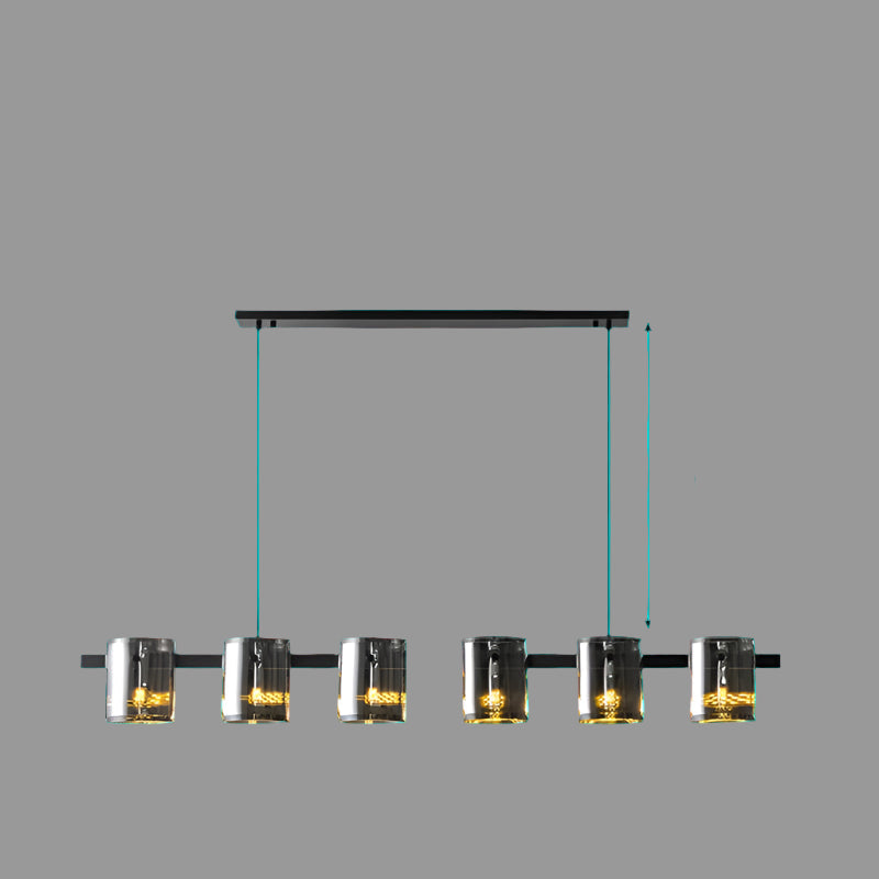 Black metal bar chandelier with warm glowing glass lamp shades