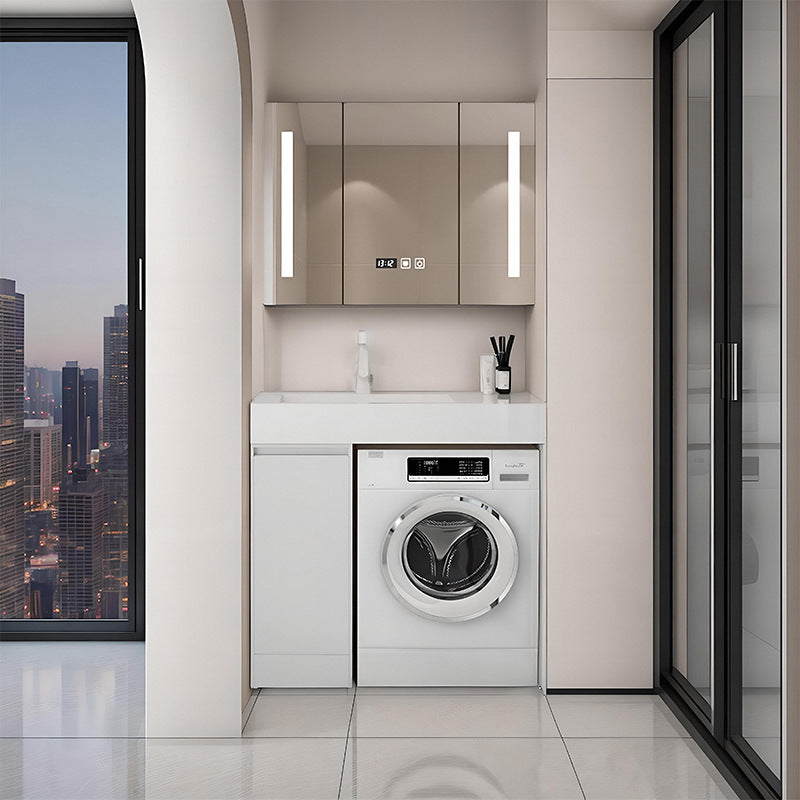 floor-standing white laundry vanity with integrated rock basin