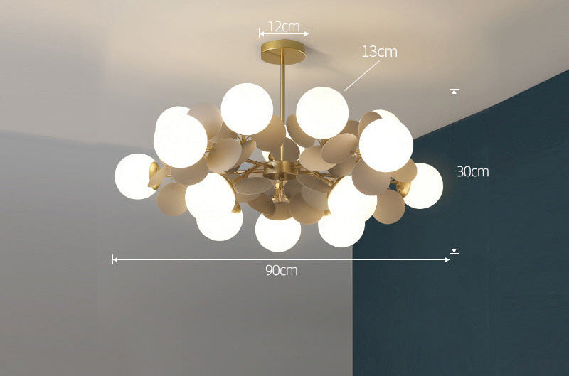 Grey globe leaf chandelier with matte metal finish and glass globes