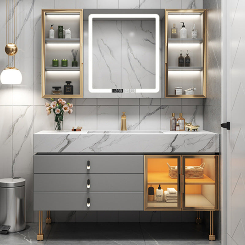 Grey rock-slab vanity with smart LED mirror cabinet