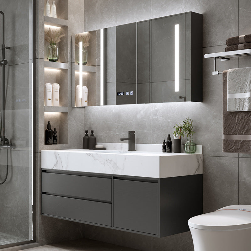 Black rock slab vanity with smart LED mirror