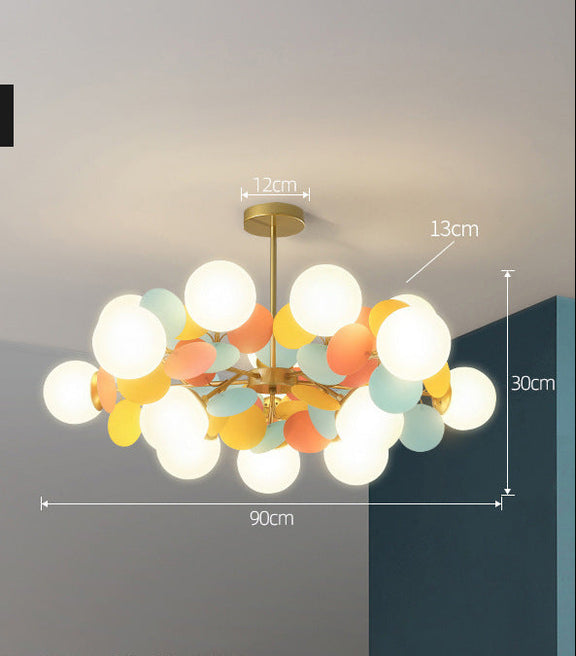 White globe leaf chandelier in contemporary bedroom setting