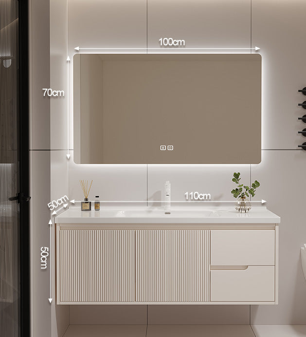 Seamless ceramic countertop with minimalist gold tap