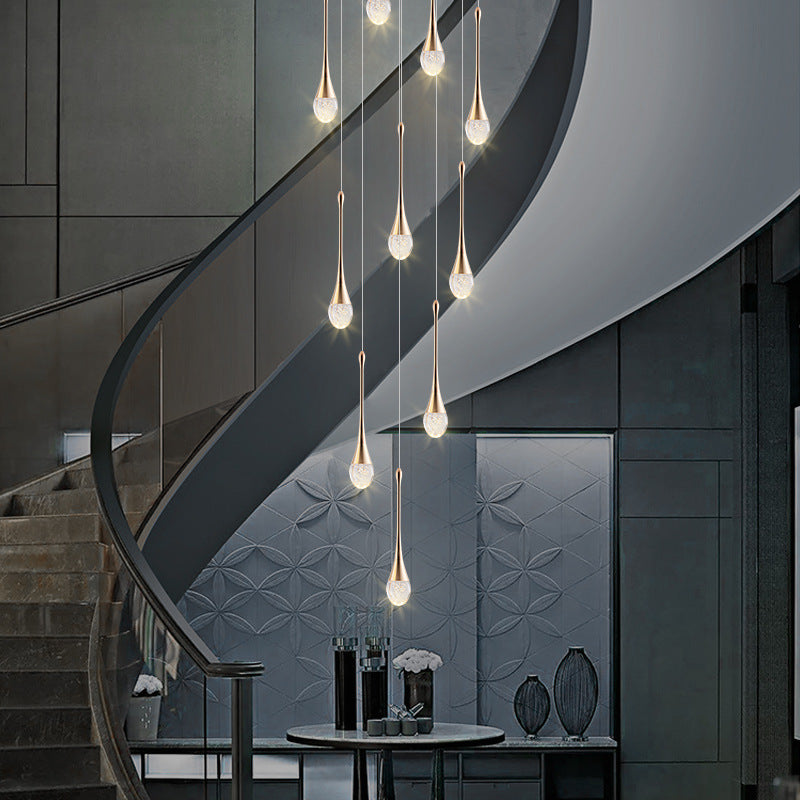 Gold crystal staircase chandelier with cascading LED droplet pendants