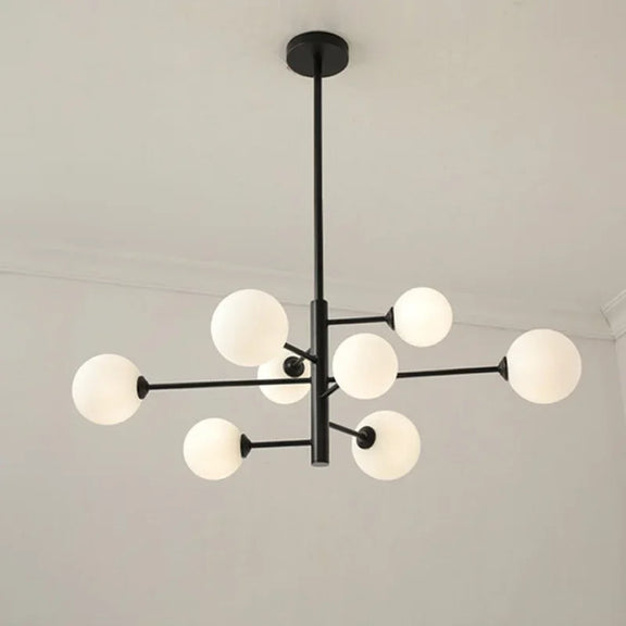 Modern brass globe chandelier with frosted glass shades