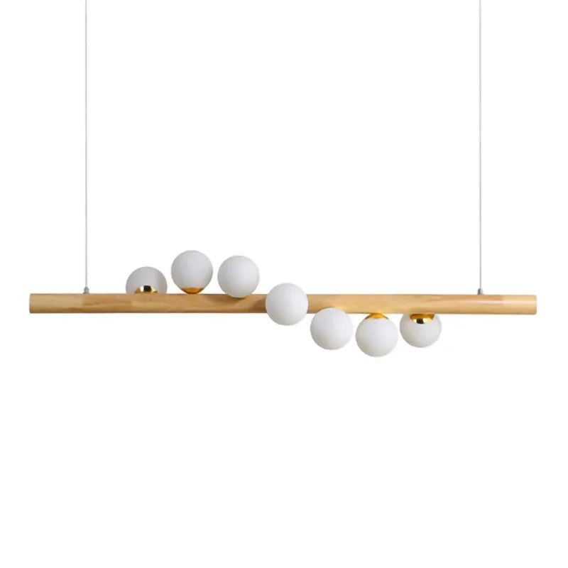 Minimalist wooden linear pendant light with white globe shades