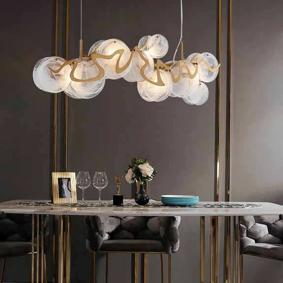 Gold art deco glass chandelier with sculpted discs