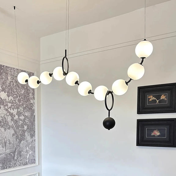 Contemporary gold hanging light with glass spheres
