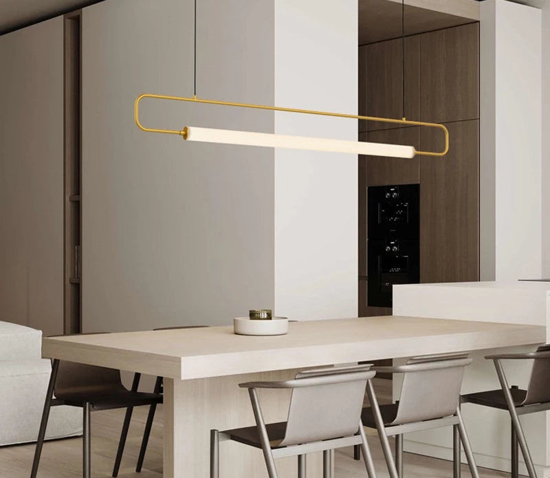 Minimalist long tube LED pendant light over dining table