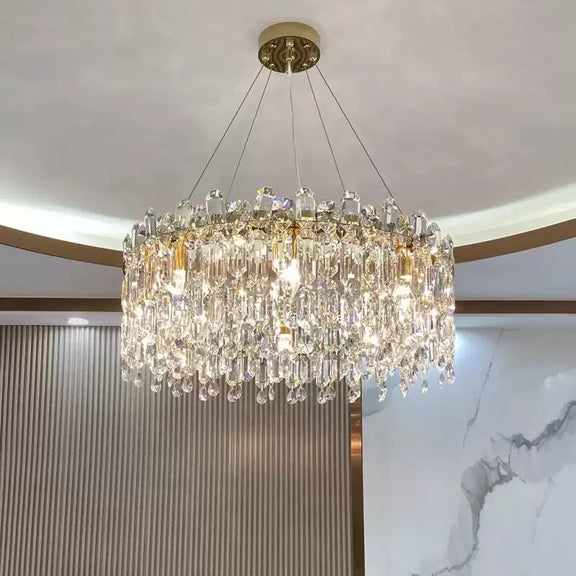 Round gold K9 crystal chandelier hanging from ceilin