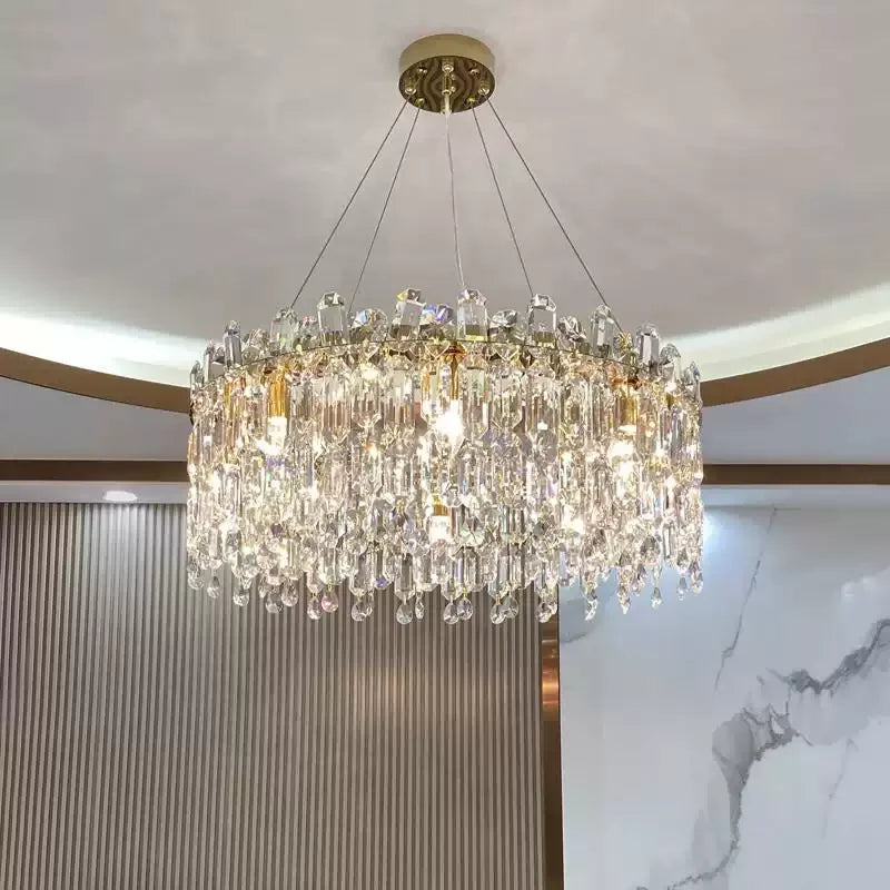 Round gold K9 crystal chandelier hanging from ceilin