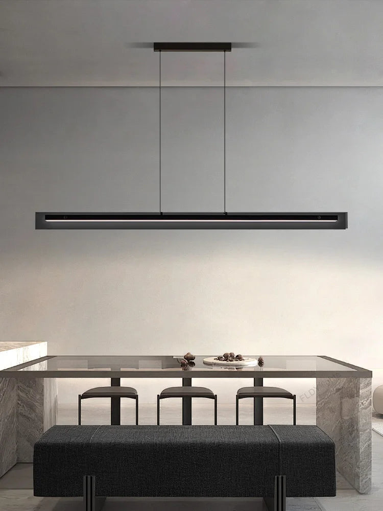 Black linear LED pendant light over dining table