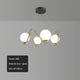 Bauhaus swirl gold chandelier with frosted globes