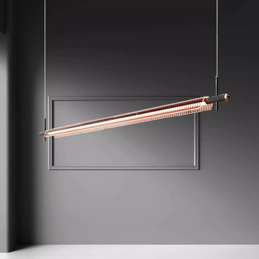 Minimalist gold linear pendant light hanging from ceiling