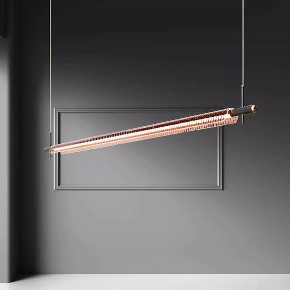 Minimalist gold linear pendant light hanging from ceiling