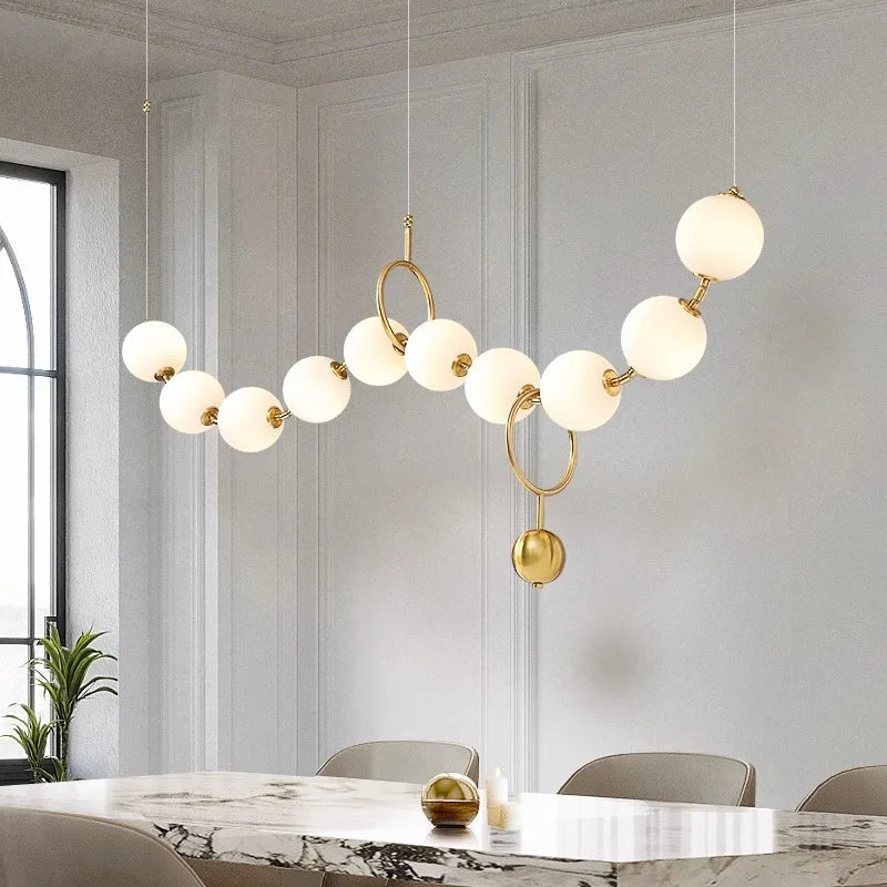 Modern gold orb LED chandelier for dining table