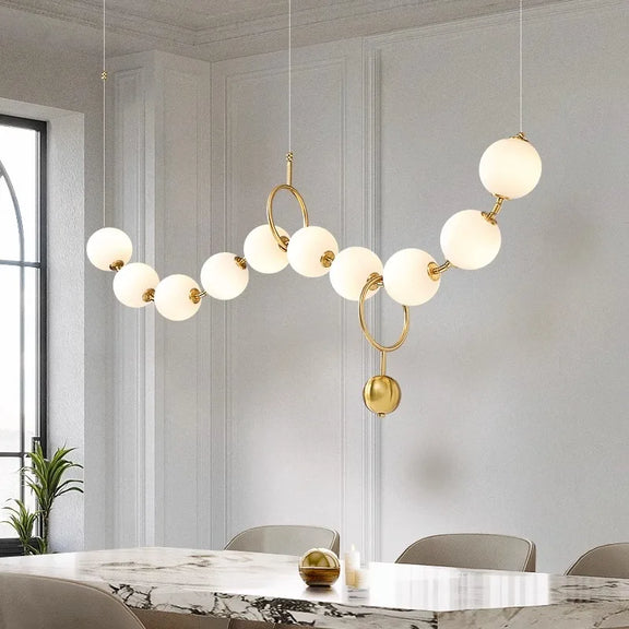 Modern gold orb LED chandelier for dining table