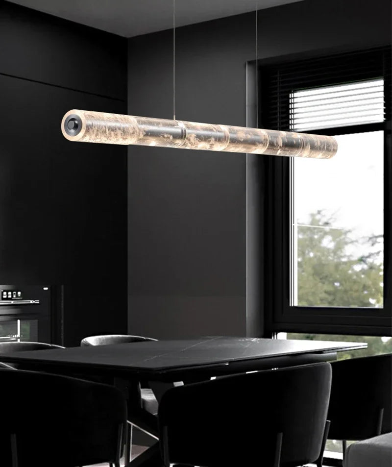 Modern modular linear LED pendant light over kitchen island