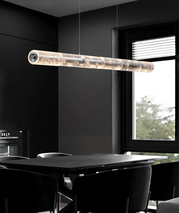 Modern modular linear LED pendant light over kitchen island
