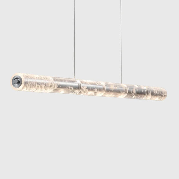 Adjustable linear LED pendant light suspended from ceiling