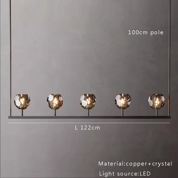 Brushed copper linear chandelier with crystal spheres