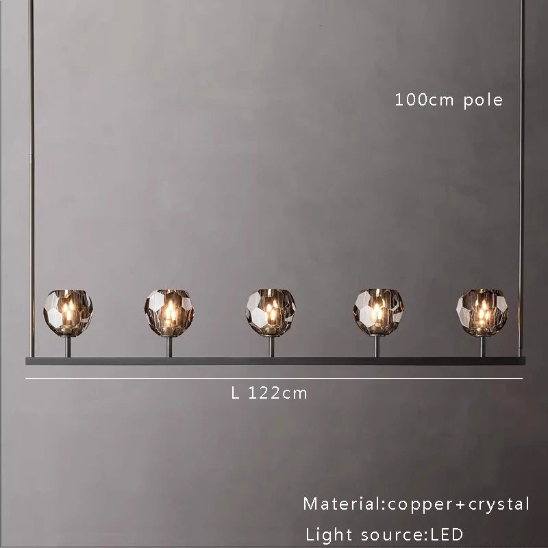 Brushed copper linear chandelier with crystal spheres
