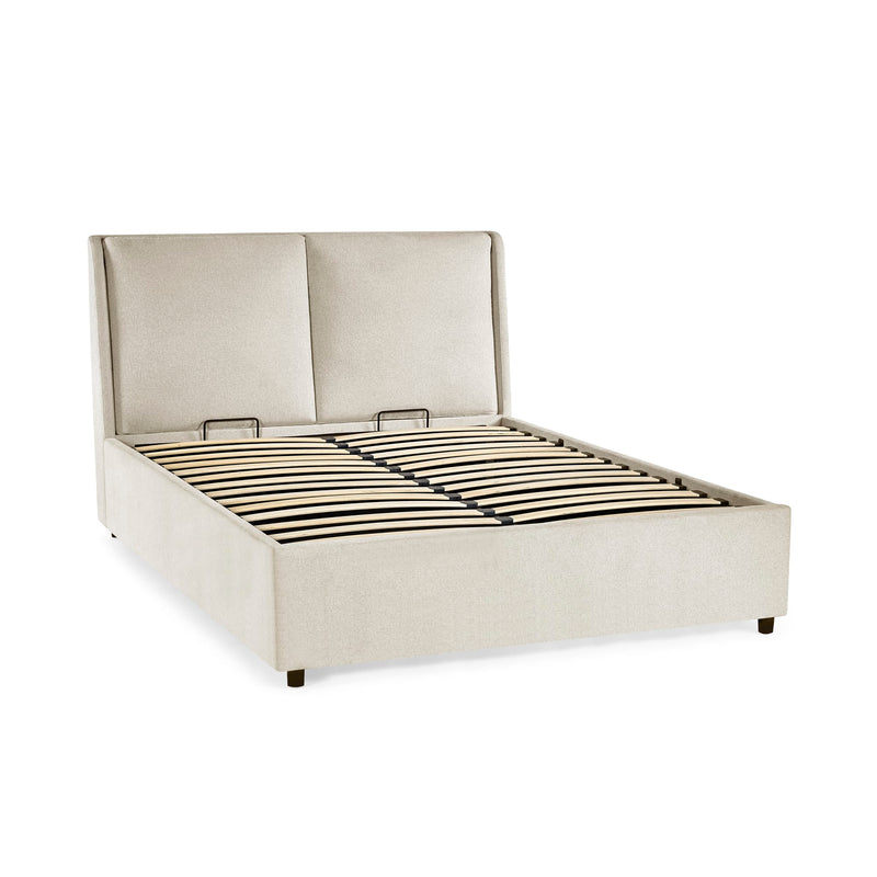 Beige upholstered bed frame on a white background