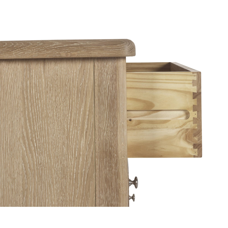Wooden drawer unit with a drawer open on a white background