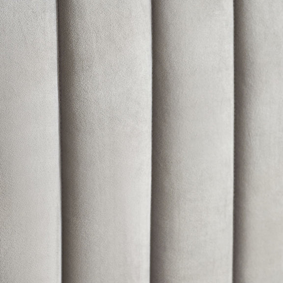 Close-up of gray textured fabric with vertical pleats