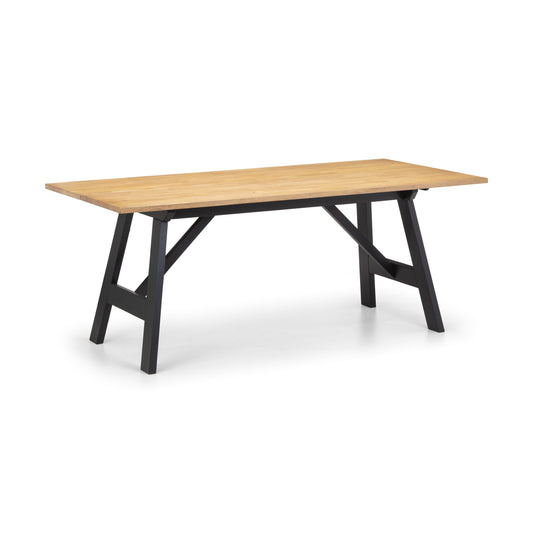 Wooden table with black legs on a white background