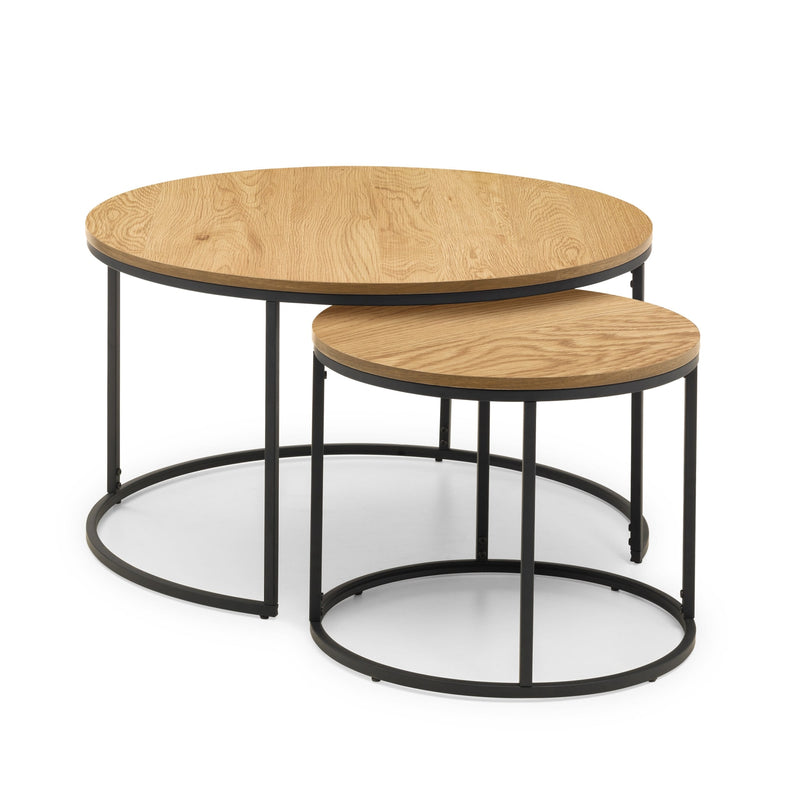 Set of two round wooden coffee tables with black metal frames on a white background