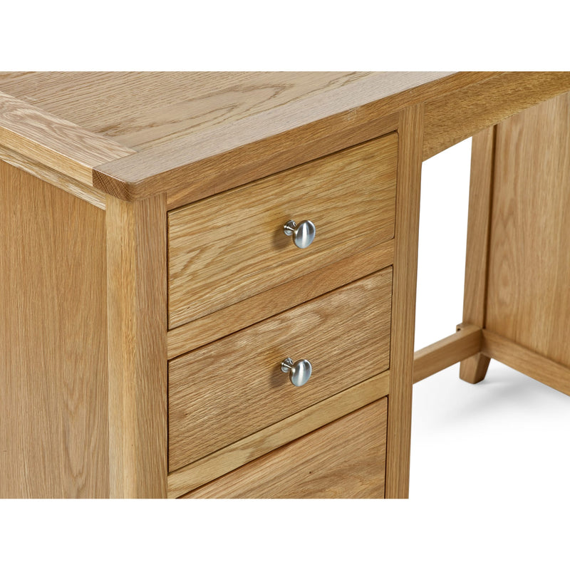 Wooden desk with two drawers and metal handles on a white background