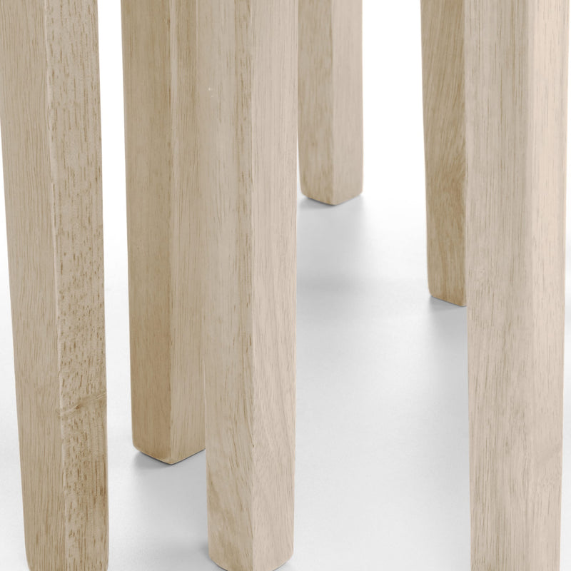 Close-up of light wood table legs on a white background