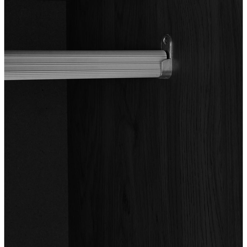Close-up of a dark wooden cabinet with a silver handle