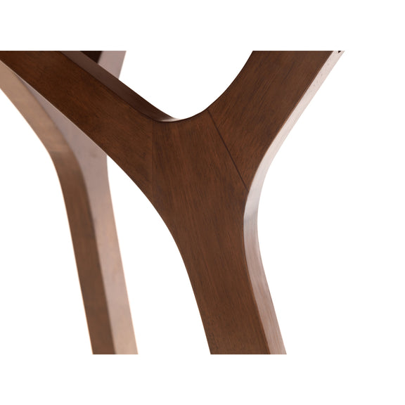 Close-up of a wooden chair leg on a white background