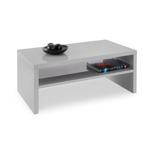White coffee table with decorative items on a white background