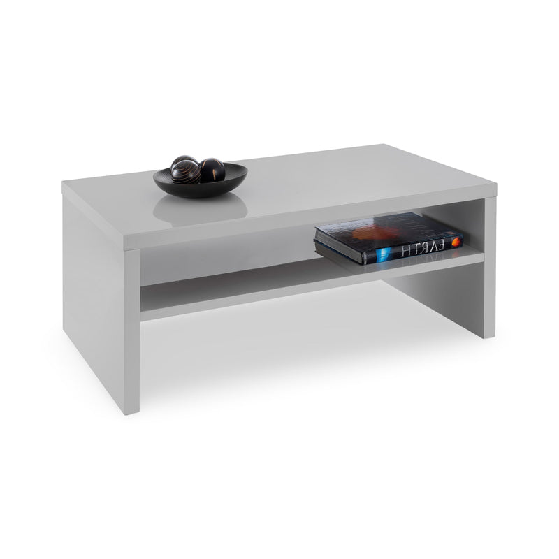 White coffee table with decorative items on a white background