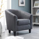Gray armchair in a room with a book and decorative elements.