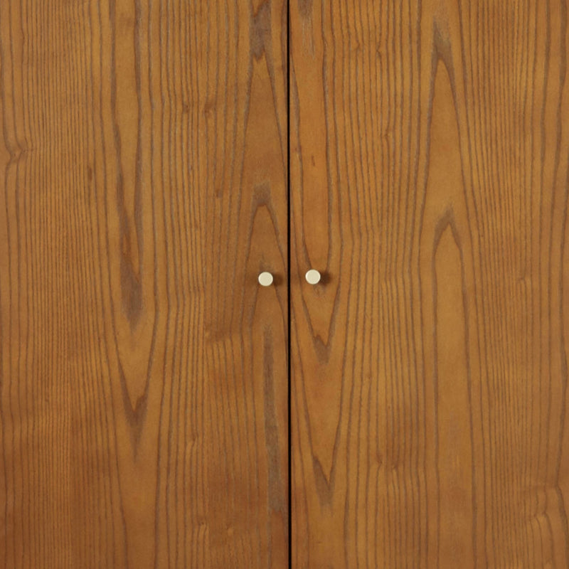 Close-up of a wooden cabinet with a visible joint and two small white knobs.