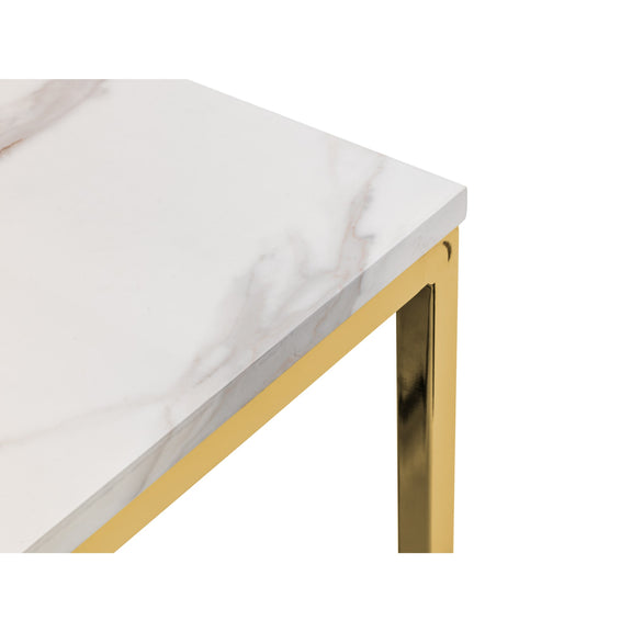 Table with white surface and gold legs on a white background