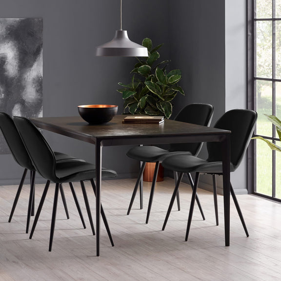 Dining room with a wooden table and black chairs in a modern interior setting.